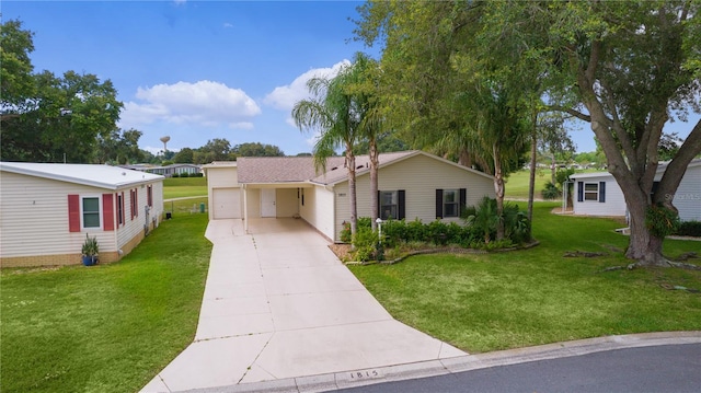 1815 Kaufman Cir, Lady Lake, FL 32159 - view of front of property featuring driveway, a front yard, and a garage