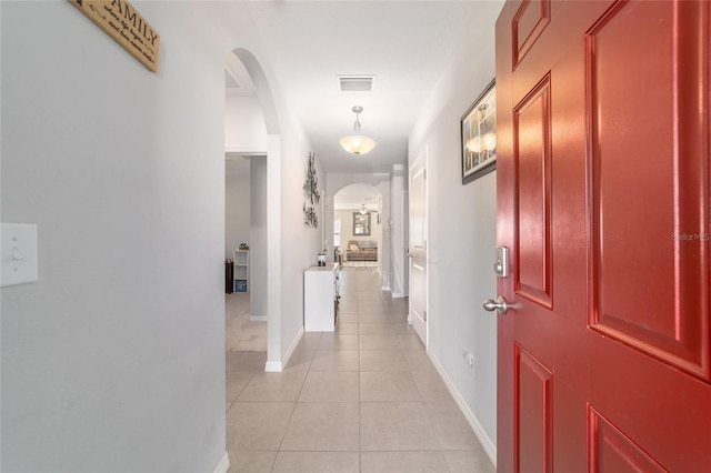 9785 Pepper Tree Trl, Wildwood, FL 34785 - corridor featuring arched walkways and light tile patterned floors