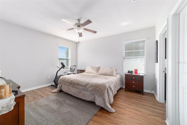 9785 Pepper Tree Trl, Wildwood, FL 34785 - bedroom featuring light wood-style floors and ceiling fan