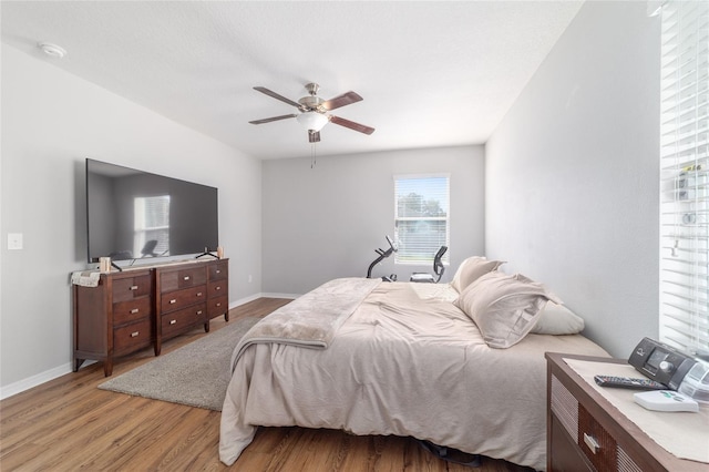9785 Pepper Tree Trl, Wildwood, FL 34785 - bedroom featuring light wood-style flooring and ceiling fan