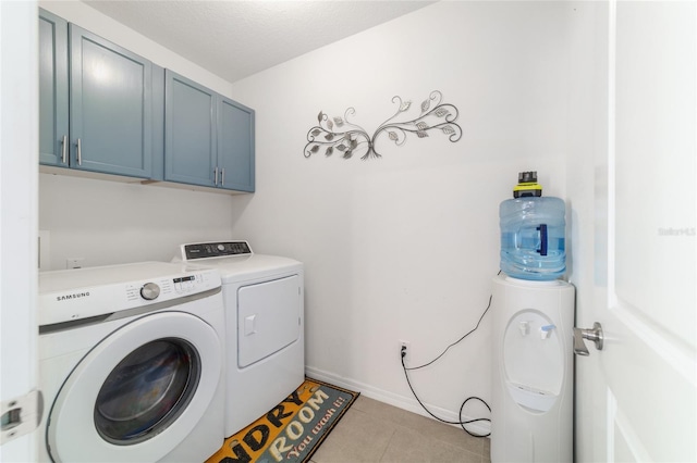 9785 Pepper Tree Trl, Wildwood, FL 34785 - washroom with cabinet space, washer and dryer, and light tile patterned floors