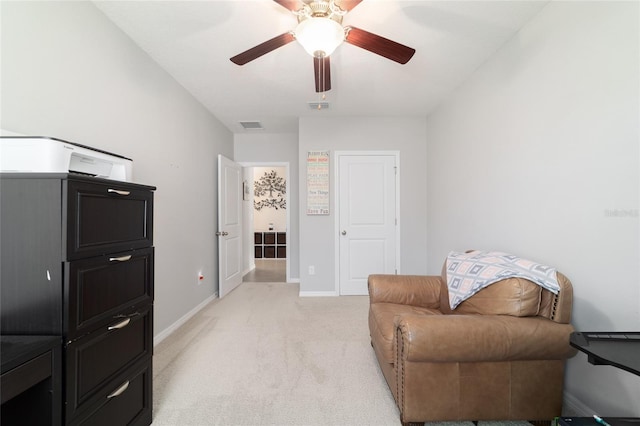 9785 Pepper Tree Trl, Wildwood, FL 34785 - sitting room with light carpet and a ceiling fan