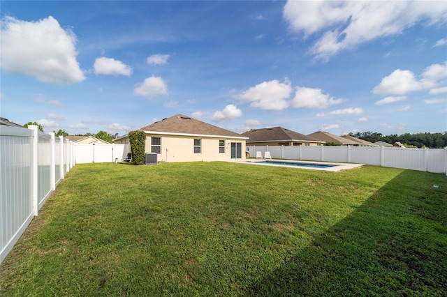 9785 Pepper Tree Trl, Wildwood, FL 34785 - rear view of house with a fenced backyard and stucco siding