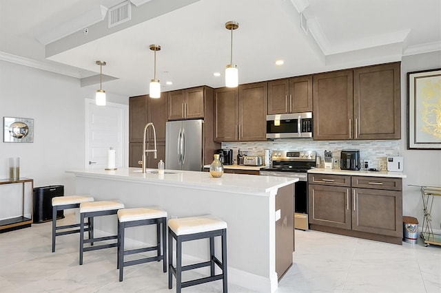 16300 County Road 455 Unit 202, Montverde, FL 34756 - kitchen with appliances with stainless steel finishes, a sink, ornamental molding, backsplash, and light marble finish floors
