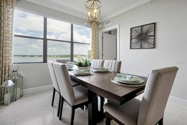 16300 County Road 455 Unit 202, Montverde, FL 34756 - dining space with light marble finish floors, crown molding, baseboards, and a water view