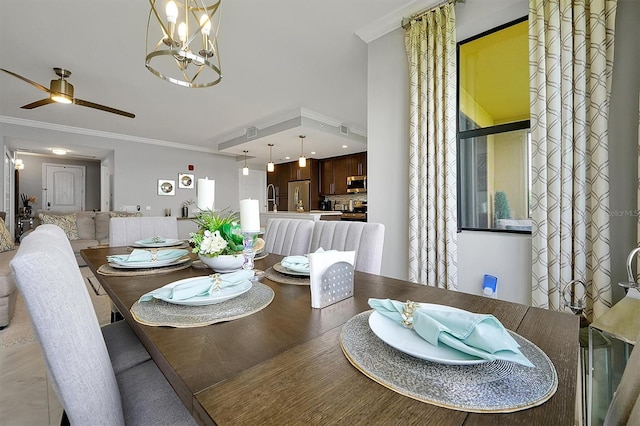 16300 County Road 455 Unit 202, Montverde, FL 34756 - dining space with ceiling fan, a chandelier, crown molding, and light wood finished floors