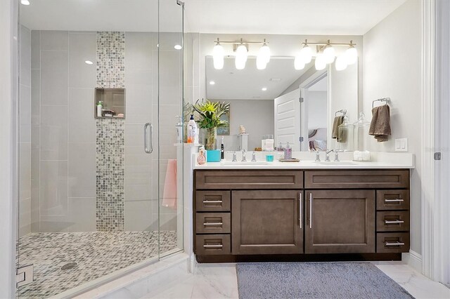 16300 County Road 455 Unit 202, Montverde, FL 34756 - full bath featuring marble finish flooring, double vanity, a shower stall, and recessed lighting