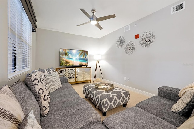 16300 County Road 455 Unit 202, Montverde, FL 34756 - carpeted living room with a ceiling fan and baseboards