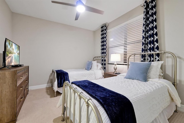 16300 County Road 455 Unit 202, Montverde, FL 34756 - bedroom featuring baseboards, light carpet, and a ceiling fan
