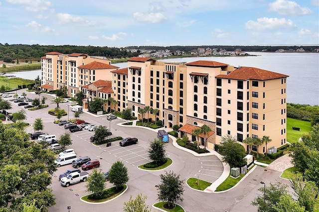 16300 County Road 455 Unit 202, Montverde, FL 34756 - view of apartment building / complex with uncovered parking and a water view
