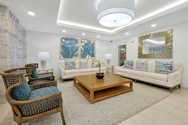 16300 County Road 455 Unit 202, Montverde, FL 34756 - living room with recessed lighting, a tray ceiling, and tile patterned floors