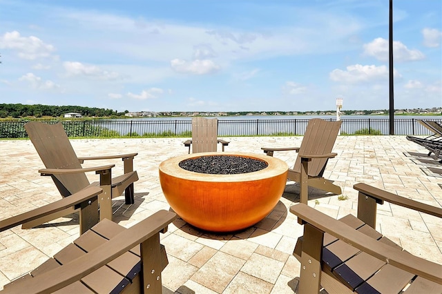 16300 County Road 455 Unit 202, Montverde, FL 34756 - view of patio / terrace with a fire pit and a water view
