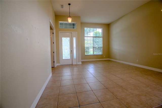 1355 Misty Glen Ln, Clermont, FL 34711 - foyer featuring light tile patterned floors and baseboards