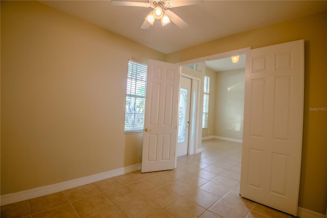 1355 Misty Glen Ln, Clermont, FL 34711 - empty room featuring light tile patterned floors and a ceiling fan