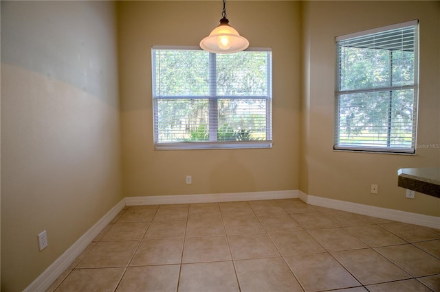 1355 Misty Glen Ln, Clermont, FL 34711 - unfurnished dining area with healthy amount of natural light and light tile patterned floors