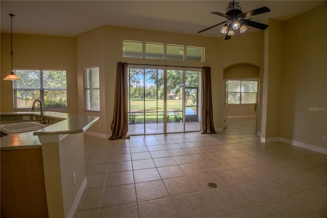 1355 Misty Glen Ln, Clermont, FL 34711 - kitchen featuring light tile patterned flooring, ceiling fan, pendant lighting, and light countertops