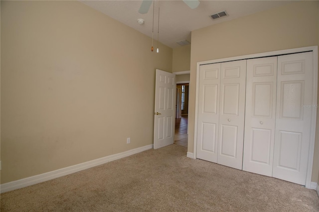 1355 Misty Glen Ln, Clermont, FL 34711 - unfurnished bedroom with carpet, a closet, and a ceiling fan