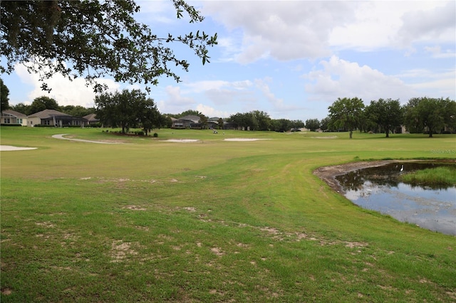 1355 Misty Glen Ln, Clermont, FL 34711 - view of community featuring a water view, a lawn, and view of golf course