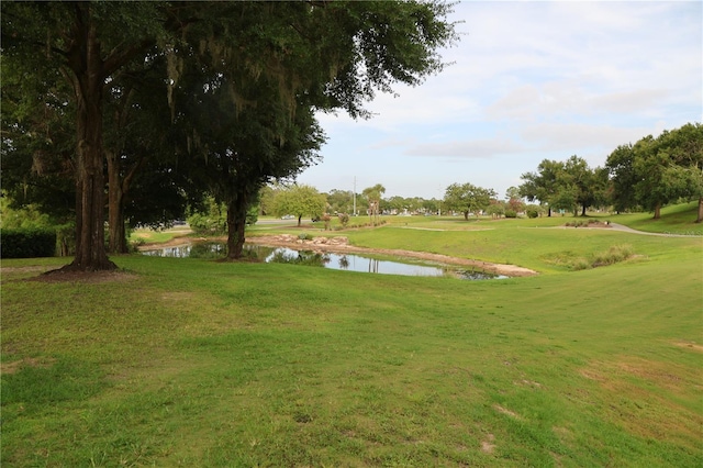 1355 Misty Glen Ln, Clermont, FL 34711 - surrounding community featuring a water view, a yard, and view of golf course