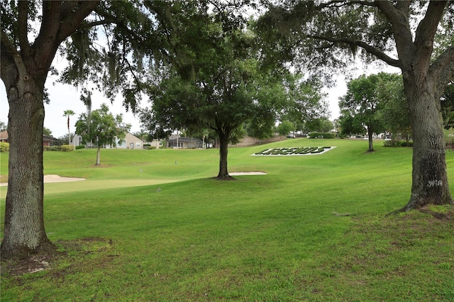 1355 Misty Glen Ln, Clermont, FL 34711 - surrounding community featuring a lawn and view of golf course