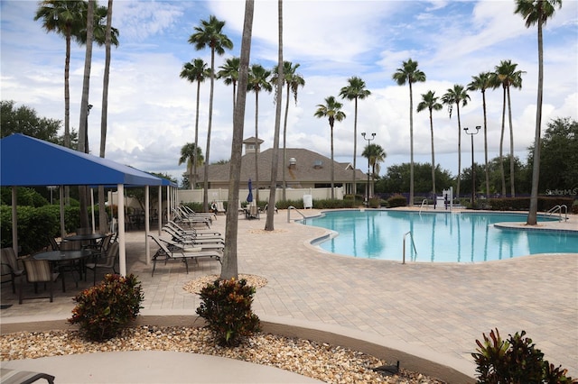 1355 Misty Glen Ln, Clermont, FL 34711 - community pool featuring a patio area