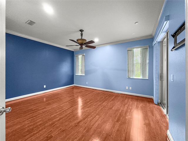 8045 Waterbury Way, Mount Dora, FL 32757 - unfurnished bedroom with crown molding, wood finished floors, and ceiling fan