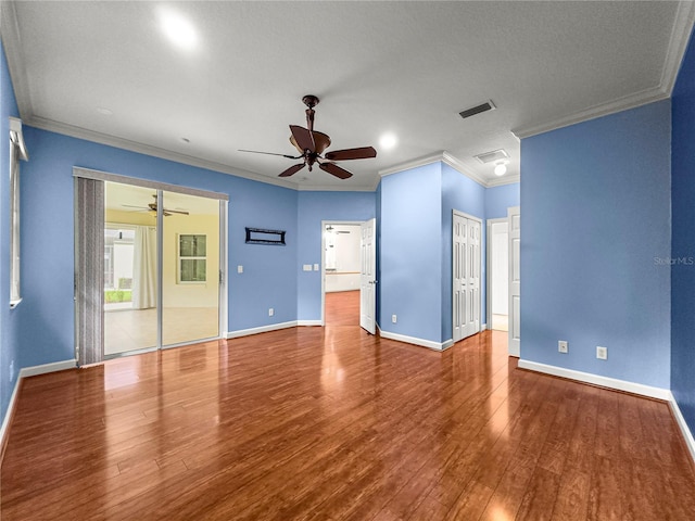 8045 Waterbury Way, Mount Dora, FL 32757 - unfurnished room with a ceiling fan, crown molding, and wood finished floors