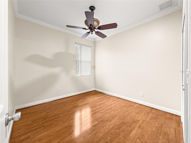 8045 Waterbury Way, Mount Dora, FL 32757 - spare room featuring crown molding, wood finished floors, and a ceiling fan
