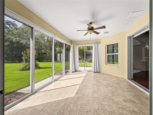 8045 Waterbury Way, Mount Dora, FL 32757 - unfurnished sunroom with a ceiling fan and tile patterned floors