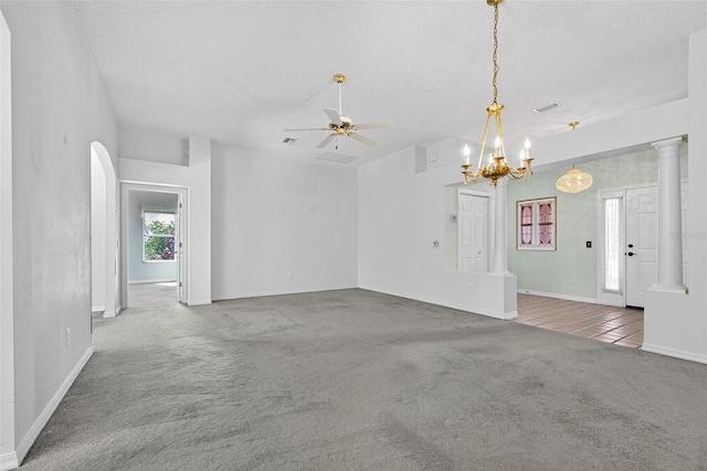 206 Palermo Pl, Lady Lake, FL 32159 - unfurnished living room with carpet floors, a ceiling fan, a chandelier, and tile patterned floors