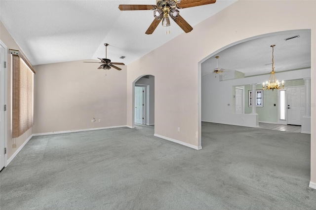 206 Palermo Pl, Lady Lake, FL 32159 - unfurnished living room featuring ceiling fan, carpet, vaulted ceiling, arched walkways, and a chandelier