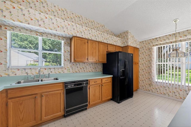 206 Palermo Pl, Lady Lake, FL 32159 - kitchen with black appliances, wallpapered walls, vaulted ceiling, light countertops, and light floors