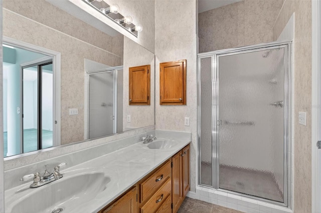 206 Palermo Pl, Lady Lake, FL 32159 - full bathroom with double vanity, a shower stall, and tile patterned flooring