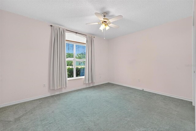 206 Palermo Pl, Lady Lake, FL 32159 - unfurnished room with ceiling fan, carpet flooring, and a textured ceiling