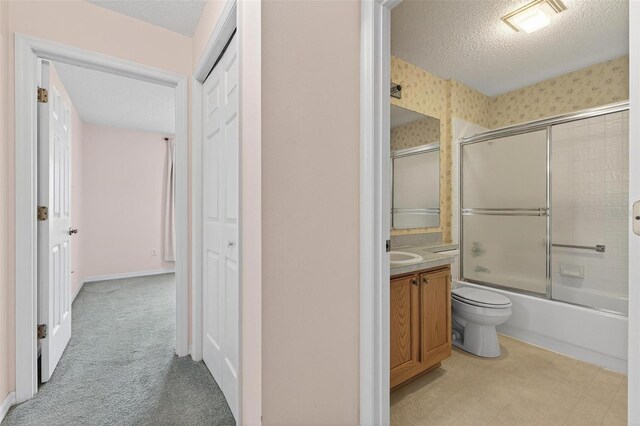206 Palermo Pl, Lady Lake, FL 32159 - bathroom featuring vanity, shower / bath combination with glass door, and a textured ceiling