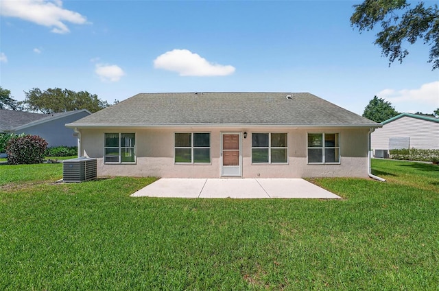 206 Palermo Pl, Lady Lake, FL 32159 - rear view of house featuring a patio, a lawn, stucco siding, and roof with shingles