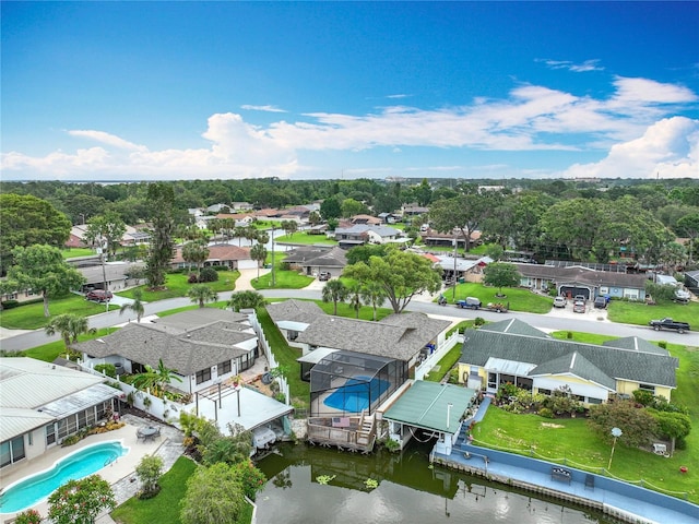 1611 Canal, Tavares, FL 32778 - aerial perspective of suburban area featuring a pool and a large body of water