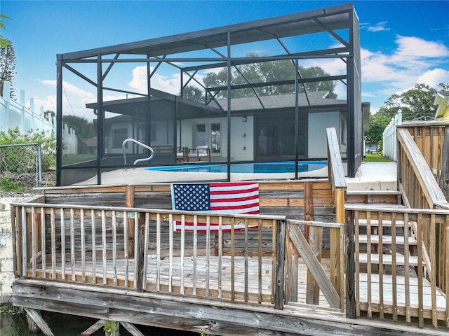 1611 Canal, Tavares, FL 32778 - back of house featuring an outdoor pool, a deck, and glass enclosure