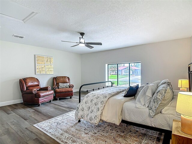 1611 Canal, Tavares, FL 32778 - bedroom featuring wood finished floors, a ceiling fan, and a textured ceiling