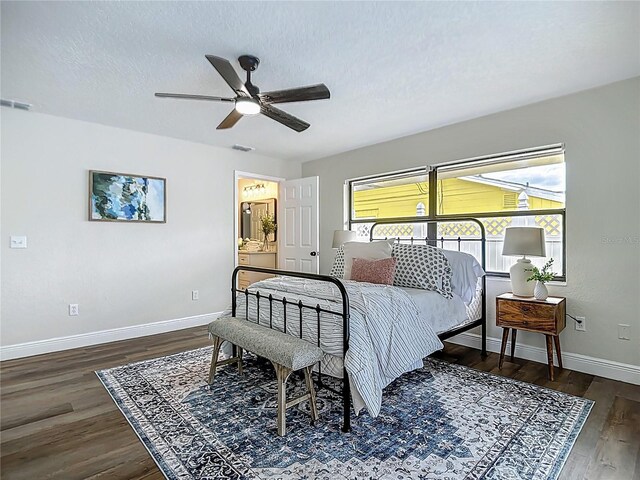 1611 Canal, Tavares, FL 32778 - bedroom with wood finished floors, a ceiling fan, and ensuite bathroom