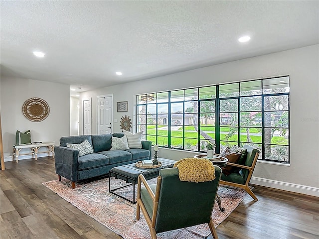 1611 Canal, Tavares, FL 32778 - living area with dark wood-style floors, recessed lighting, and a textured ceiling