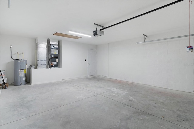 14631 SE 95th Ct, Summerfield, FL 34491 - garage with electric water heater, a garage door opener, and heating unit