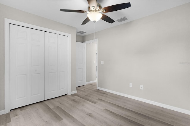 14631 SE 95th Ct, Summerfield, FL 34491 - unfurnished bedroom with wood finished floors, a closet, and ceiling fan