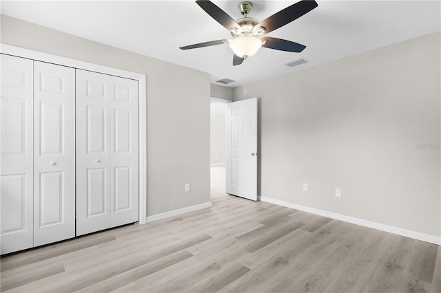 14631 SE 95th Ct, Summerfield, FL 34491 - unfurnished bedroom featuring light wood finished floors, a closet, and a ceiling fan