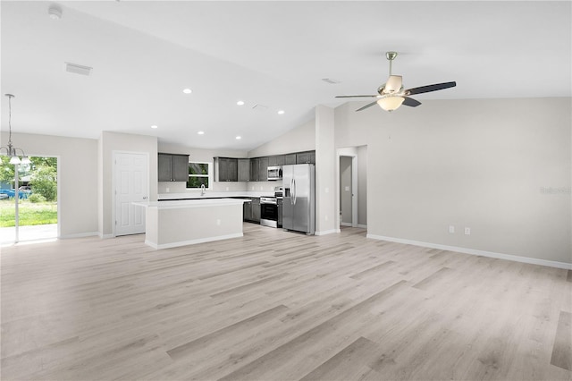 14631 SE 95th Ct, Summerfield, FL 34491 - unfurnished living room featuring ceiling fan, a chandelier, light wood-type flooring, high vaulted ceiling, and recessed lighting