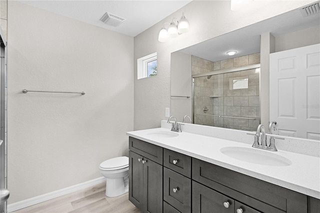 14631 SE 95th Ct, Summerfield, FL 34491 - full bath featuring double vanity, wood finished floors, and a shower stall