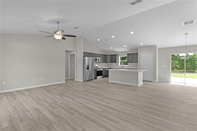 14611 SE 95th Ct, Summerfield, FL 34491 - unfurnished living room with healthy amount of natural light, recessed lighting, light wood-style flooring, ceiling fan, and a chandelier