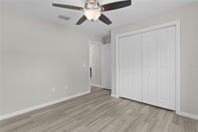 14611 SE 95th Ct, Summerfield, FL 34491 - unfurnished bedroom with light wood-style flooring, a closet, and ceiling fan