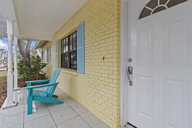 11770 W Sunnybrook Ct, Crystal River, FL 34429 - property entrance with a porch and brick siding