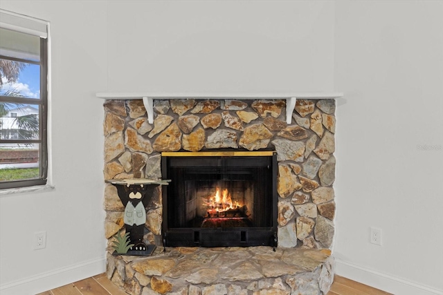 11770 W Sunnybrook Ct, Crystal River, FL 34429 - detailed view of a lit fireplace and wood finished floors